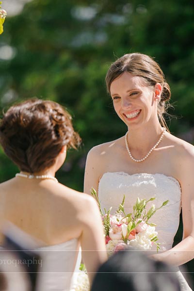 brides smiling at each other